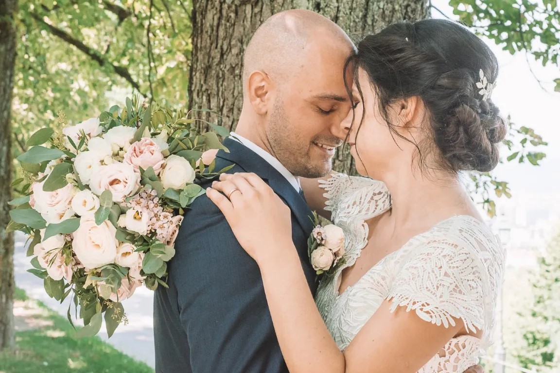 Bride in front of Ljubljana Castle during golden hour